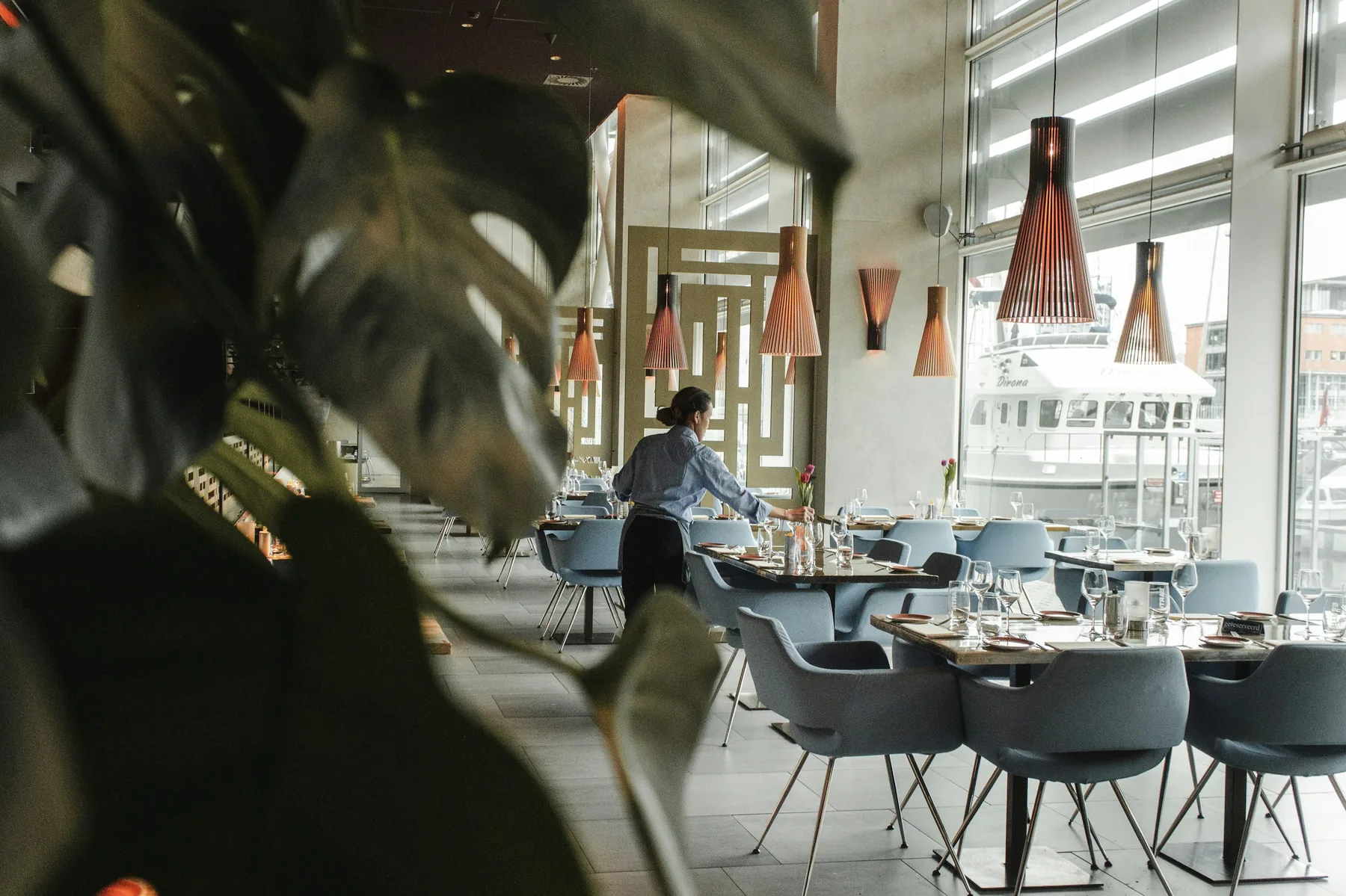 Contemporary restaurant interior with warm lighting, presented as a visual reference.